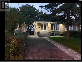 Toronto (Parkwoods-Donalda) apartment for rent - A house is shown with a driveway in front of it.