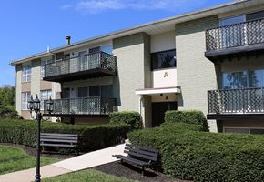 Lancaster apartment for rent - an apartment building with two benches in front of it
