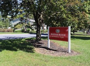 Lancaster apartment for rent - a sign sitting in the grass next to a tree
