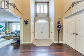 Burlington (Rose) apartment for rent - A hallway with a white door and a purple and blue striped object on a stand.