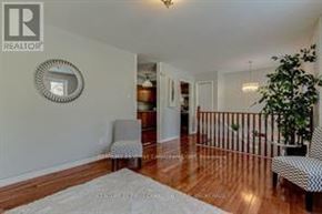 London East (East P) apartment for rent - A living room with a white rug and a grey chair.