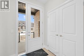 Kawartha Lakes (Lindsay) townhouse for rent - A white door with a glass window is open to a balcony.