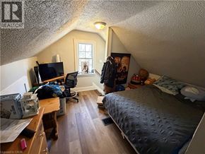 St. Catharines apartment for rent - A bedroom with a bed, desk, and chair.