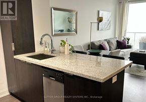 Toronto (Mimico) condo for rent - A kitchen with a countertop and a dishwasher.