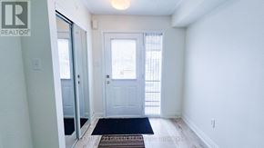Markham (Greensborough) townhouse for rent - A hallway with a door and a window.