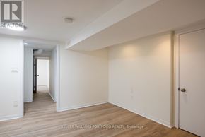 Toronto (Dovercourt-Wallace Emerson-Junction) apartment for rent - A hallway with wood floors and white walls.