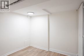 Toronto (Dovercourt-Wallace Emerson-Junction) apartment for rent - A white empty room with a light on the ceiling.