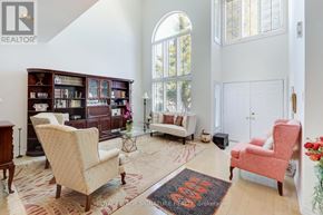 Pickering (Amberlea) apartment for rent - A living room with a rug on the floor and a chair in the corner.