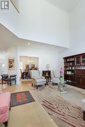 Pickering (Amberlea) apartment for rent - A living room with a pink couch and a glass coffee table.