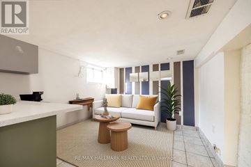 Toronto (East End-Danforth) apartment for rent - A living room with a white couch and a wooden coffee table.