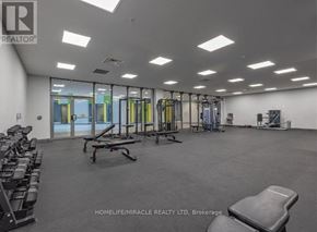 Kingston (Central City East) condo for rent - A gym with a variety of equipment including treadmills, weights, and exercise machines.