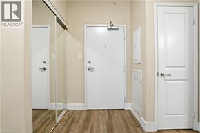 Hamilton apartment for rent - A white door is in the middle of a hallway.