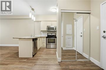 Hamilton apartment for rent - A kitchen with a white counter top and a stainless steel oven.