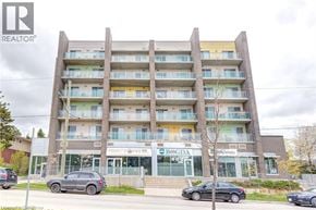 Waterloo condo for rent - A large apartment building with a sign that says "BOGDA" on the front.