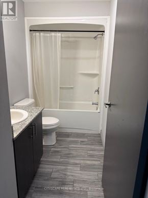 Waterloo condo for rent - A bathroom with a toilet, sink, and shower.