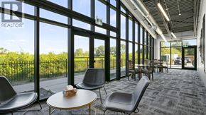 Lasalle condo for rent - A waiting area with chairs and tables is shown.