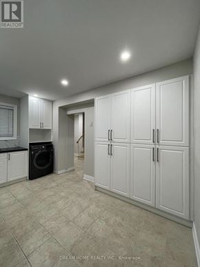 Toronto (Pleasant View) apartment for rent - A laundry room with a washer and dryer in it.