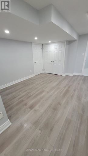 Pickering (Village East) apartment for rent - A room with wood flooring and white walls.