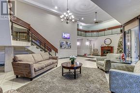 London East (East K) condo for rent - A living room with a staircase and a television.