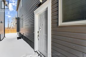 Ottawa apartment for rent - A white door is on the left side of a house.