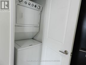 Mississauga (City Centre) condo for rent - A white oven and dishwasher are installed in a kitchen.