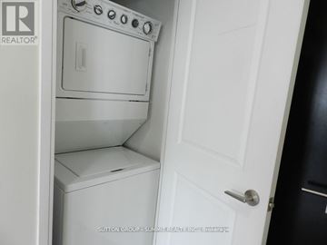 Mississauga (City Centre) condo for rent - A white oven and dishwasher are installed in a kitchen.