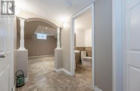 Kitchener apartment for rent - A brokerage image of a home interior with a bathroom and a hallway.