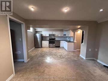 Kitchener apartment for rent - A kitchen area with a refrigerator, dishwasher, and stove.