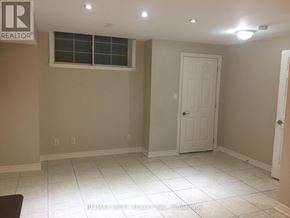 Toronto (Weston-Pellam Park) apartment for rent - A room with a white door and a window.