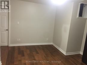 Toronto (Weston-Pellam Park) apartment for rent - A room with a wooden floor and a door.
