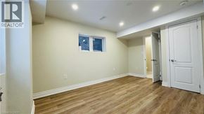Kitchener apartment for rent - A room with a white door and a window with a white frame.