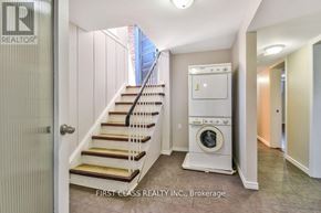 Toronto (Guildwood) apartment for rent - A realtor photo of a laundry room with a washer and dryer.