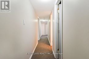 Toronto (Guildwood) apartment for rent - A long hallway with a door on the right.