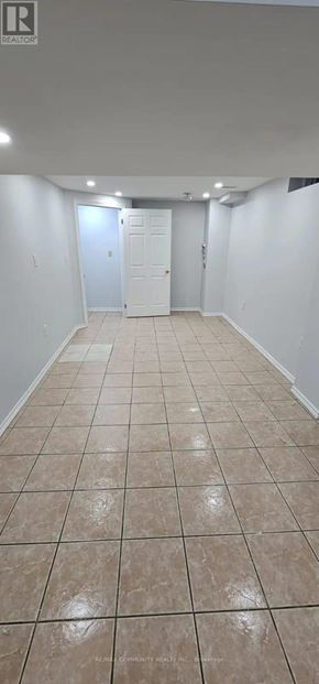Brampton (Fletcher's West) apartment for rent - A room with white walls and tile flooring.