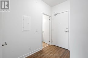 Clarington (Bowmanville) condo for rent - A white room with a door on the right and a window on the left.