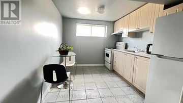 Richmond Hill (Mill Pond) apartment for rent - A kitchen with a white fridge, black chair and a plant on the counter.