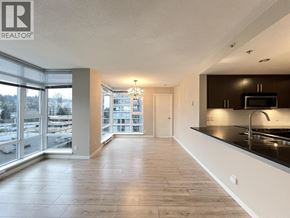 Coquitlam apartment for rent - A spacious kitchen with a microwave and a sink.