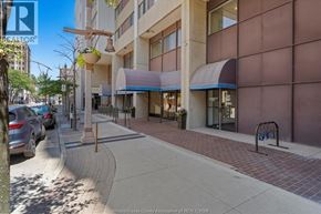 Windsor condo for rent - A street view of a building with a sign that reads "REALTOR".