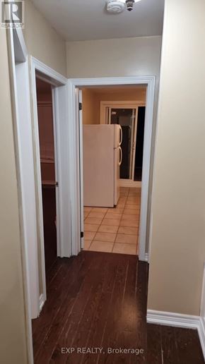 Toronto (Rockcliffe-Smythe) apartment for rent - A hallway with a refrigerator in the background.