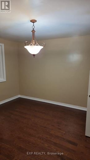 Toronto (Rockcliffe-Smythe) apartment for rent - A room with a chandelier hanging from the ceiling.