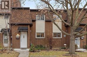Windsor townhouse for rent - A house with a tree in front of it.
