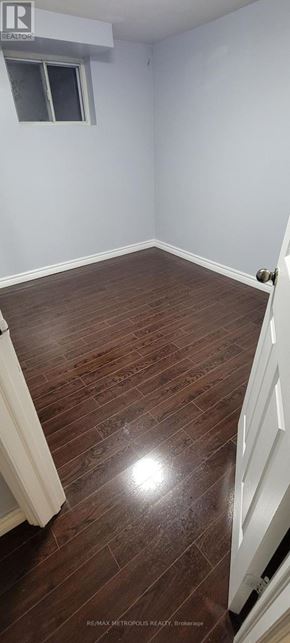 Toronto (Bendale) apartment for rent - A room with wooden flooring and a window.