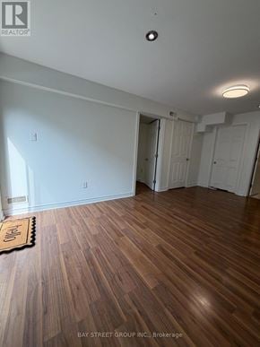 Aurora (Aurora Grove) townhouse for rent - A room with wooden floors and white walls, with a mat on the floor.