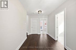 Ottawa apartment for rent - A white room with a door and a sign that says Royal LePage Team Realty, Brokerage.