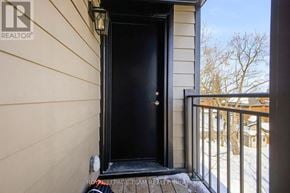 Ottawa apartment for rent - A black door is on the left side of a white wall.