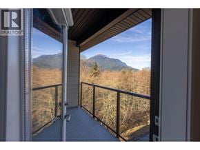 Squamish apartment for rent - A balcony with a mountain view in the distance.