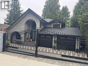 North Vancouver apartment for rent - A house with a brown garage door is surrounded by a brick driveway.