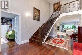 North Vancouver apartment for rent - A large, open living room with a staircase leading to the upper floor.