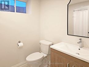 St. Catharines (Haig) apartment for rent - A white toilet and sink in a bathroom.
