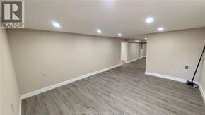 Windsor apartment for rent - A room with wooden flooring and a REALTOR® logo on the wall.